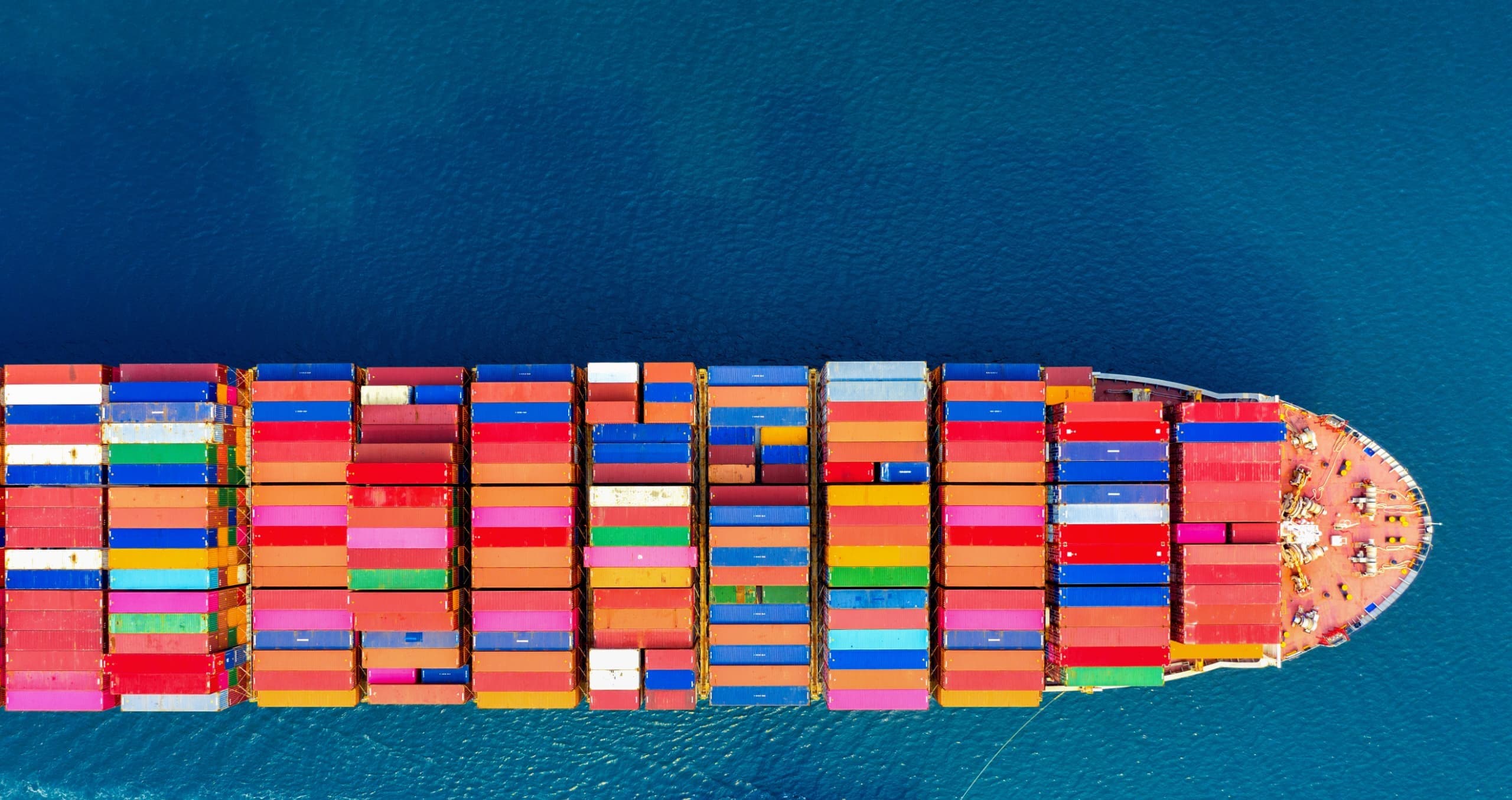 Aerial view of a loaded container ship at sea